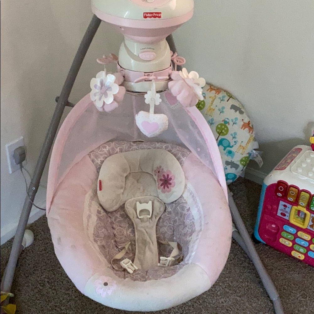 Pink baby swing